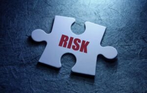 Puzzle part with word "Risk" on it
